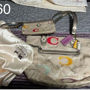 Wristlet 8 in W by 4 in T.   Purse 14 in W by 11 T